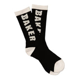 Pair of black crew socks with white Baker logo lettering, white cuffs, heels, and toes. White Letters Black Socks | Baker.