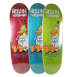 Heroin Skateboards Ducky Guest Egg decks in red, blue, and green, showing a surprised duck hatching from an egg.
