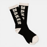 Pair of black crew socks with white Baker logo lettering, white cuffs, heels, and toes. White Letters Black Socks | Baker.