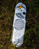 Quasi Skateboards Crockett 'Bellyachin' 8.25" Deck with starburst, cow-print hat, wavy pattern on pine branches.