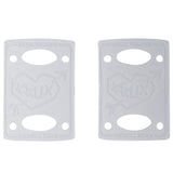 Pair of white 1/8in Krux Riser Pads with 'Krux Trucks' branding and a heart with arrow graphic.