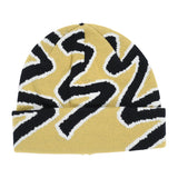 Quasi Skateboards Slug Beanie in mustard with black and white abstract knit pattern