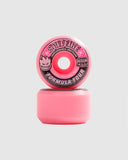 Two pink Spitfire F4 99D Conical Full Formula Four skateboard wheels, one standing on top of another, on a grey background.